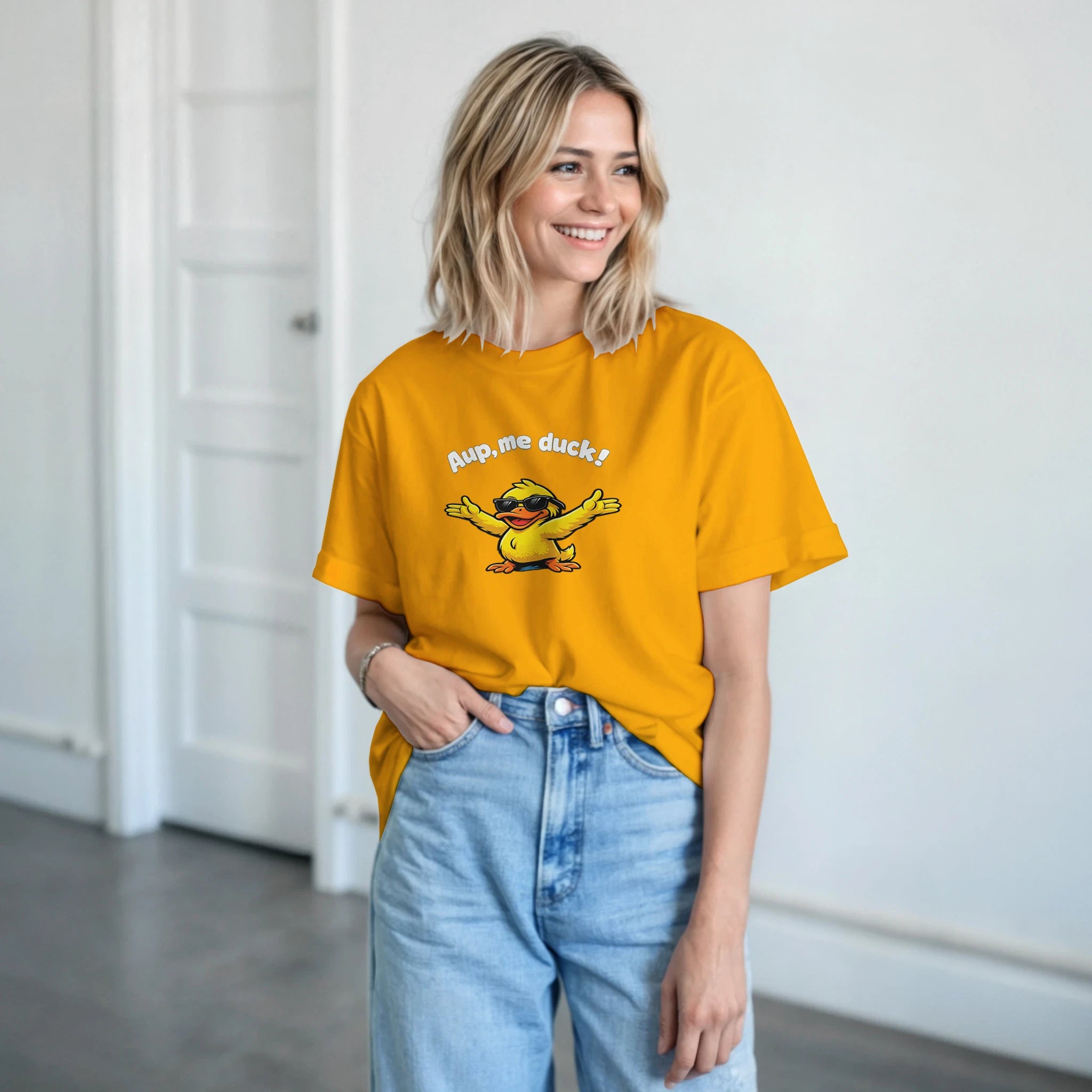 Unisex yellow crewneck T-shirt with duck graphic and 'Aup, me duck!' print, worn